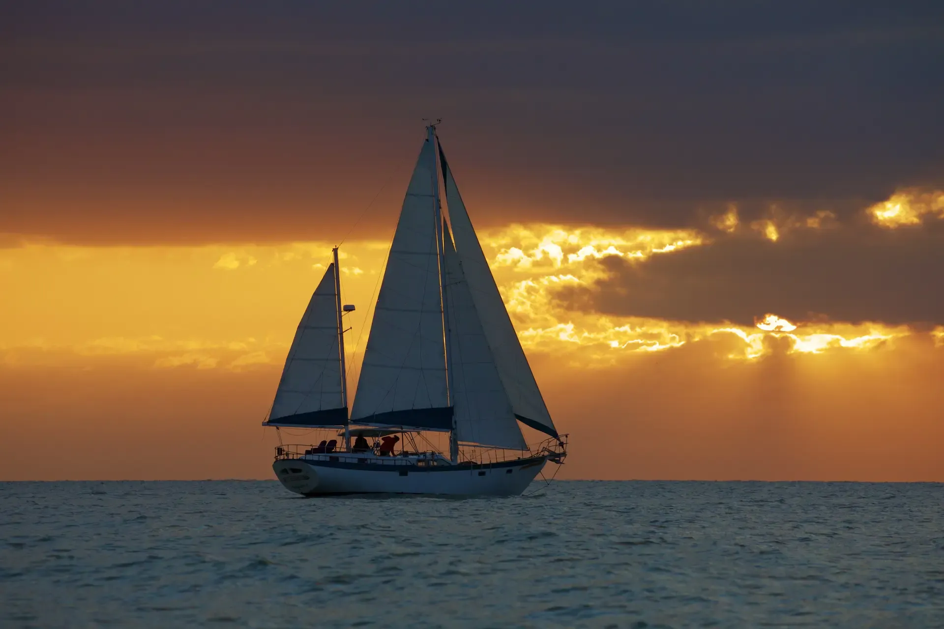 SV Cay Michele sailing at sunset near Tampa