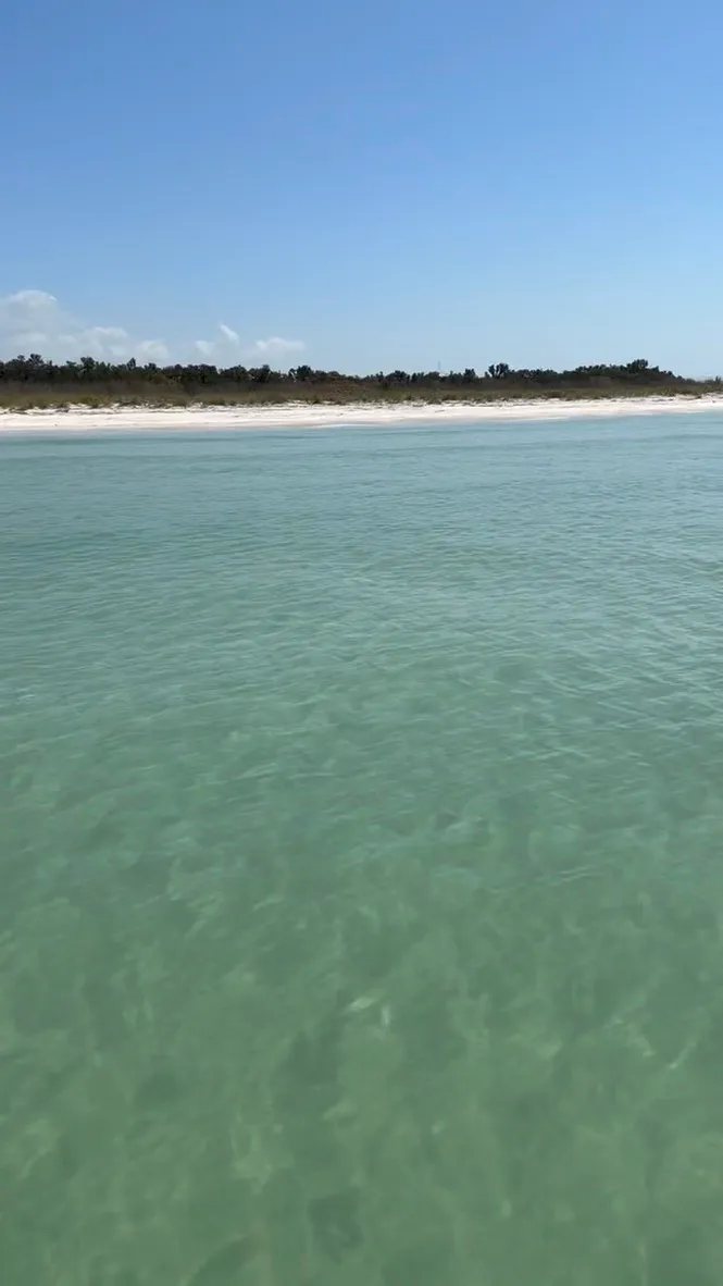 Shallow turquoise water at a St. Pete sandbar near St. Pete Beach