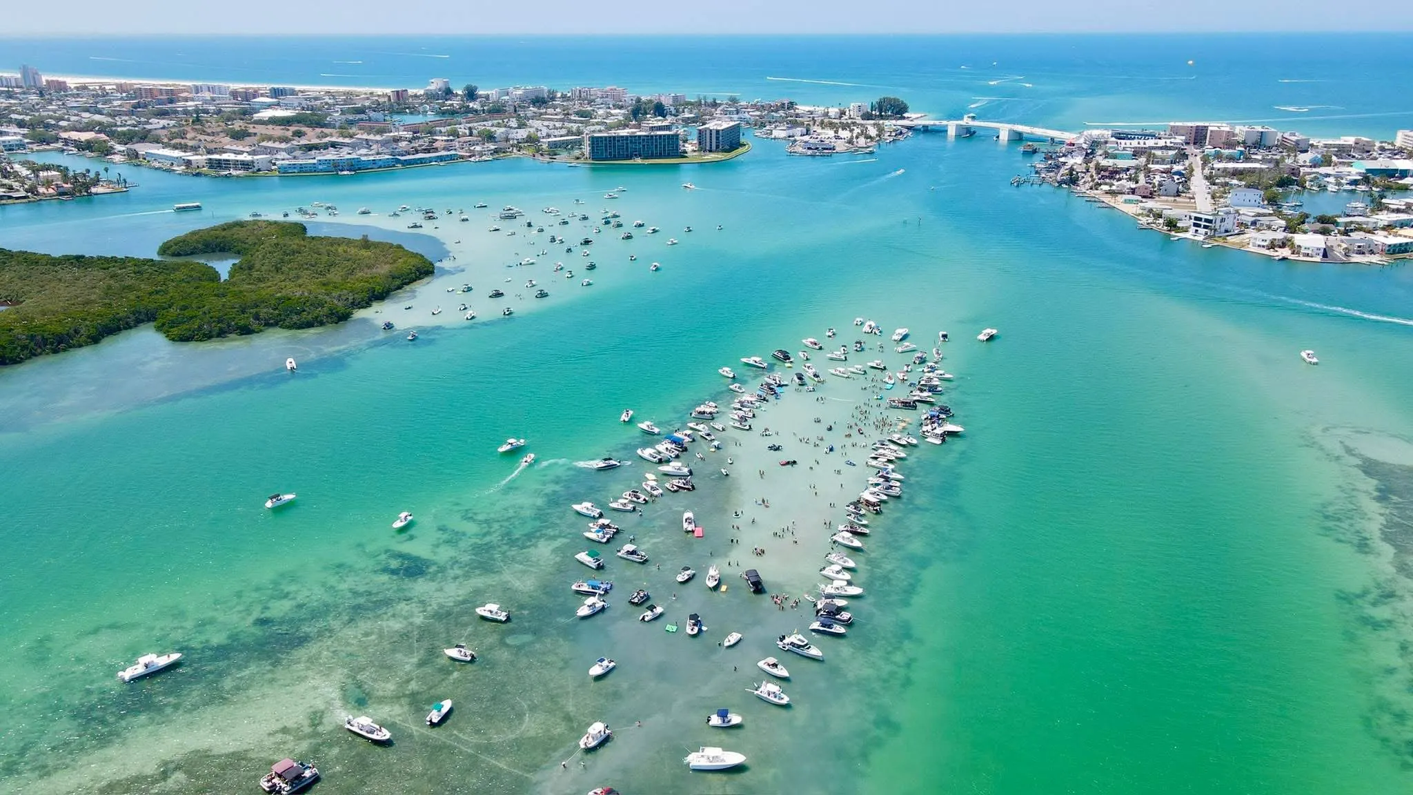 Aerial view of boats rafted up at a busy St. Pete sandbar party