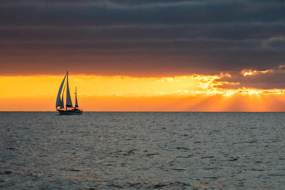 Sailboat silhouette at sunset on the Gulf of Mexico