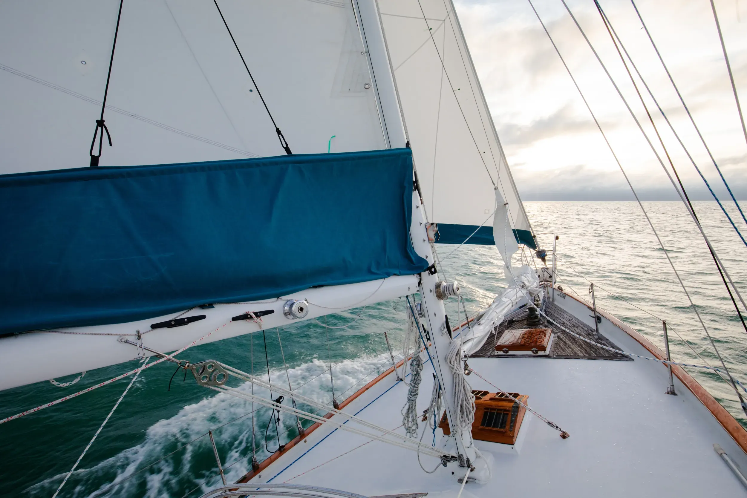 SV Cay Michele foredeck under sail on the Gulf of Mexico with teak trim and rigging